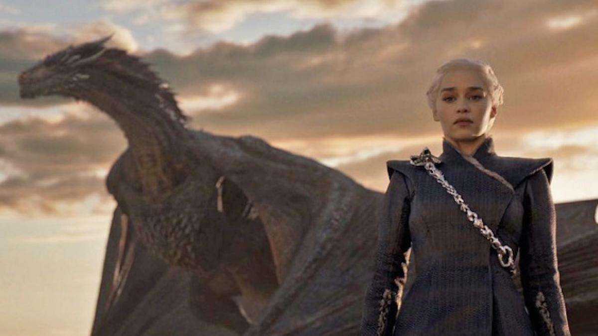 Daenerys standing in front of Drogon