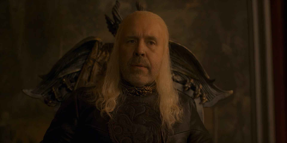 King Viserys sits pensively during his son's Nameday celebration.