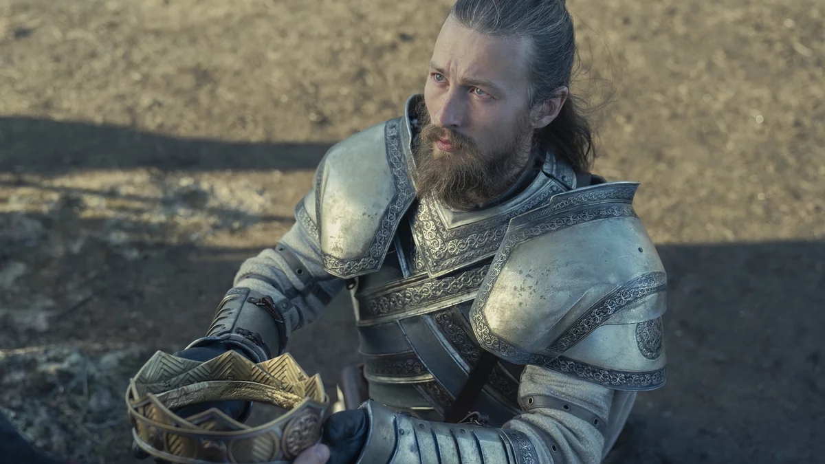 Ser Erryk Cargyll presents Rhaenyra with her father's crown.